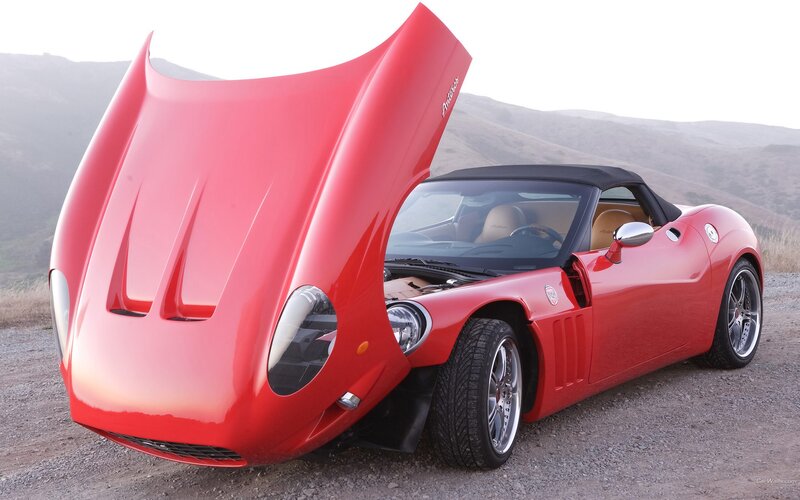 Red sports car with open hood