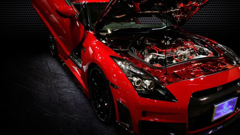 Red sports car with open hood