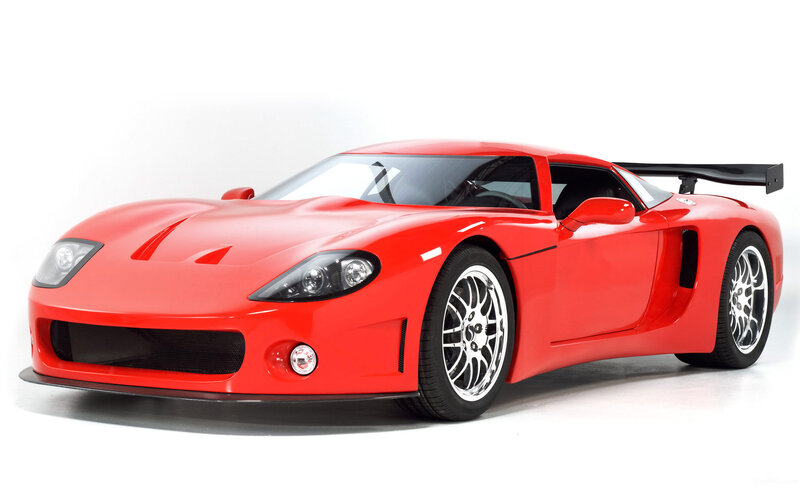 Red sports car with rear wing