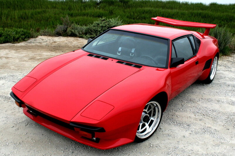 Red sports car with rear wing