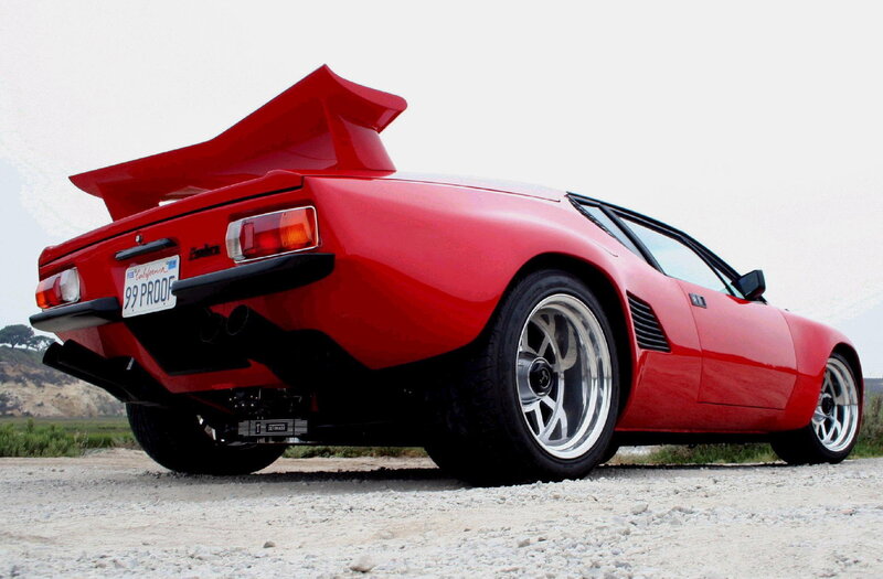 Red sports car with rear wing