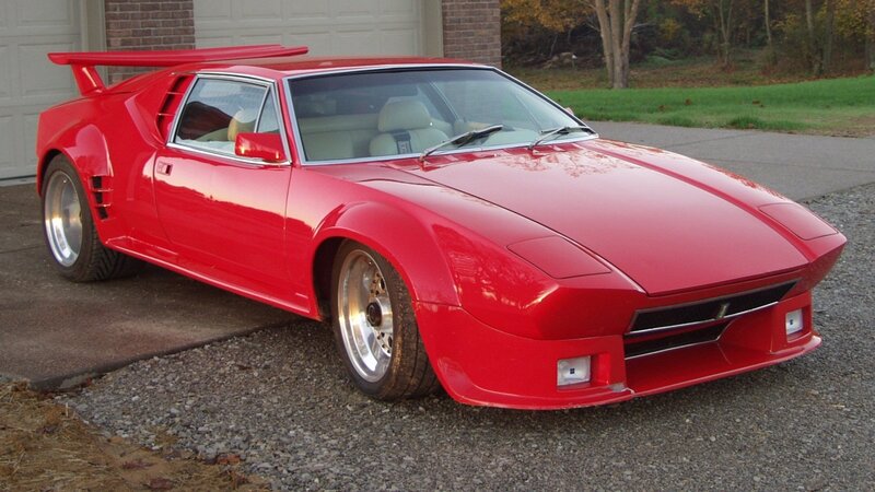 Red sports car with rear wing