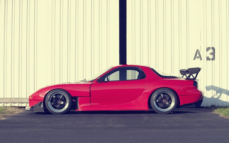 red sports car with rear wing