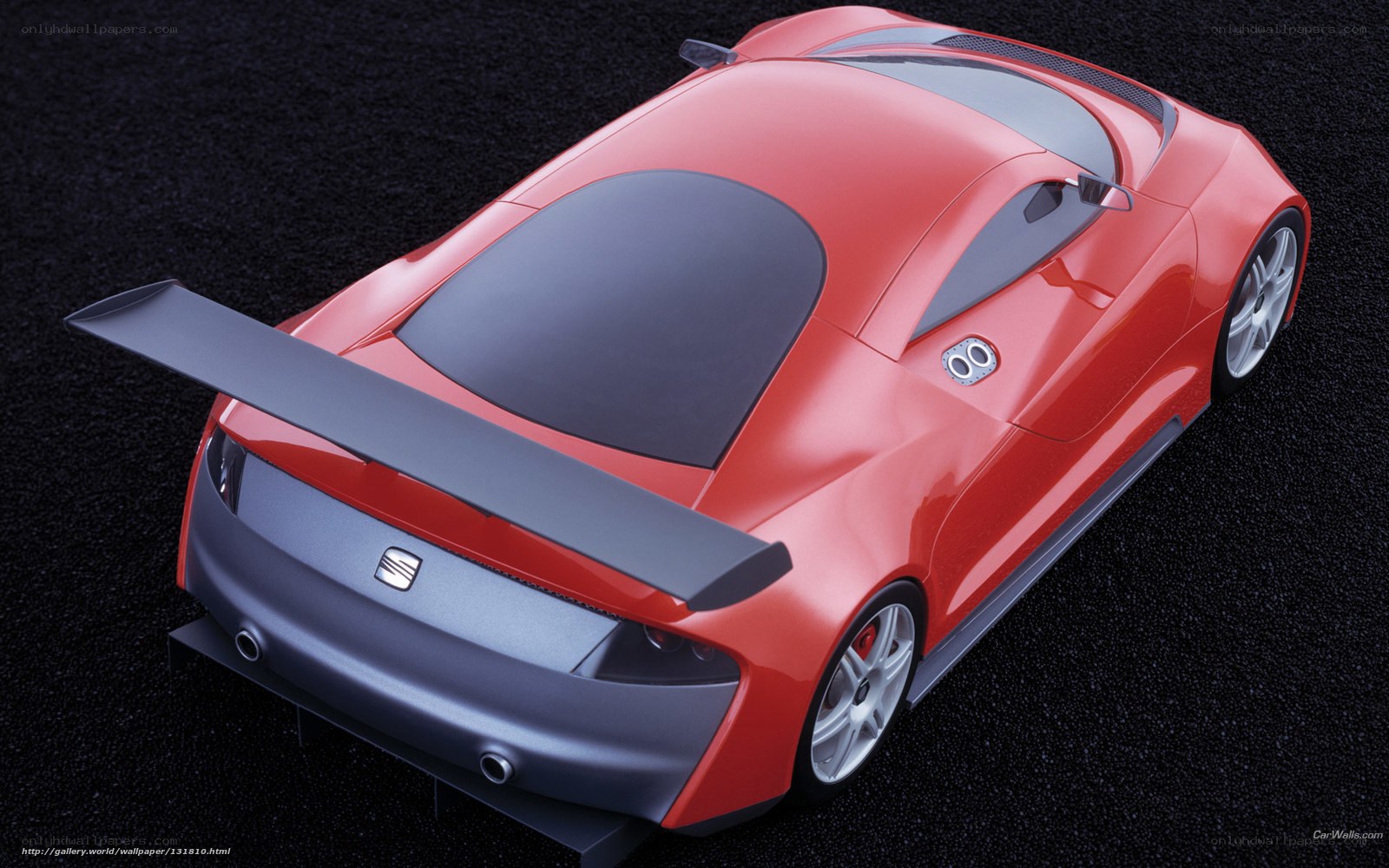 Red sports car with rear wing