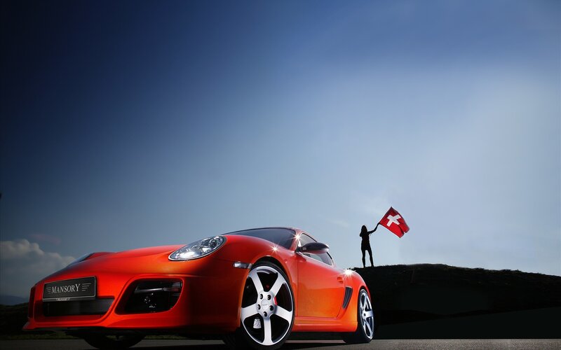 Red sports car with Swiss flag
