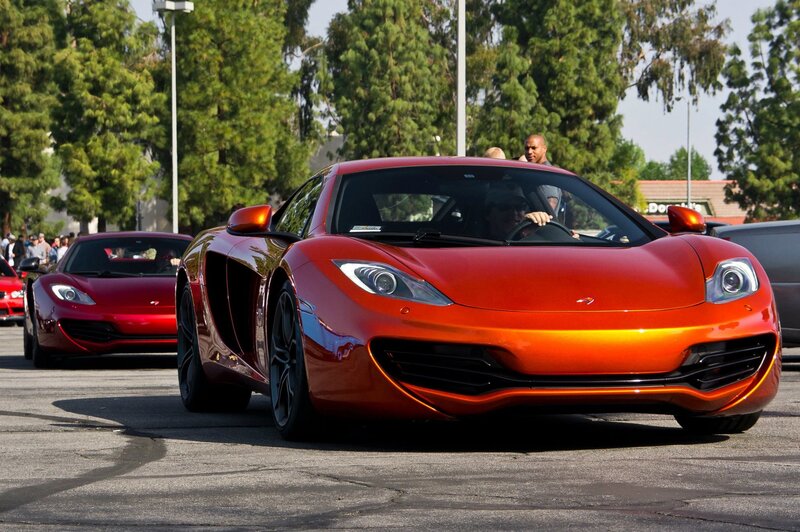 Red sports cars at a car show