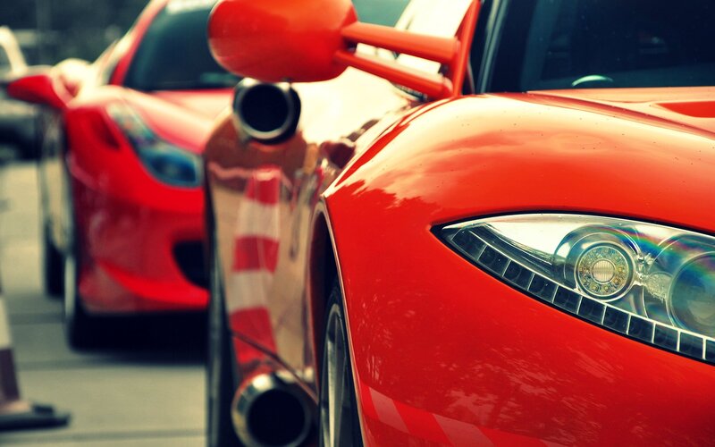 Red sports cars in a row