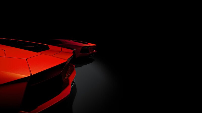 Red sports cars in dark studio