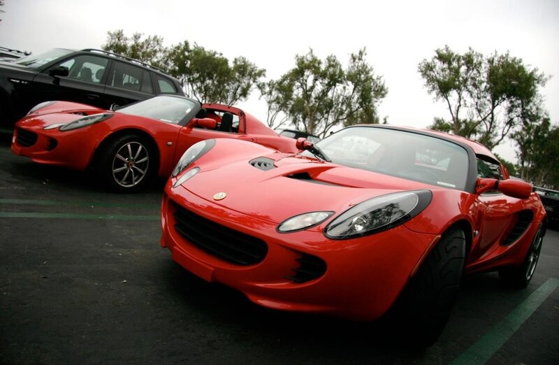 Red sports cars in parking lot