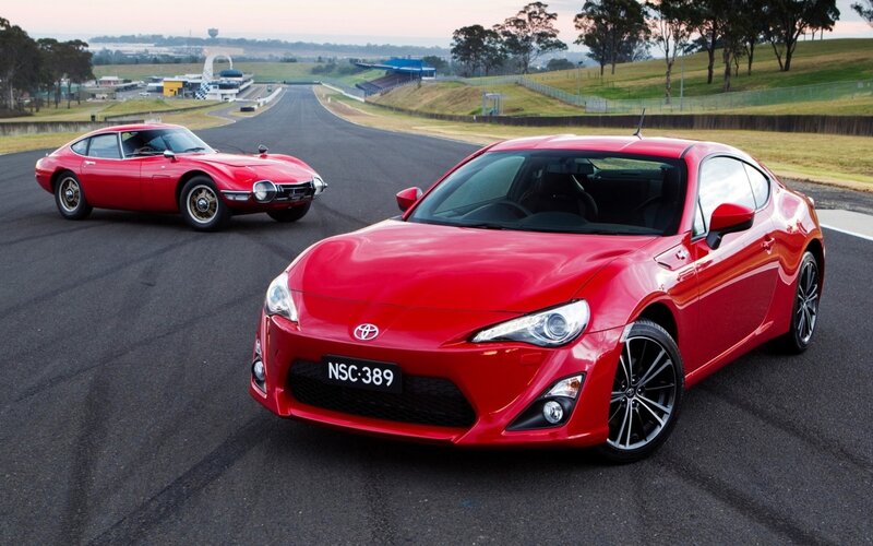 Red sports cars on a racetrack