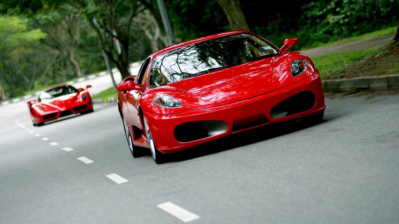 Red Sports Cars on Road — Dynamic