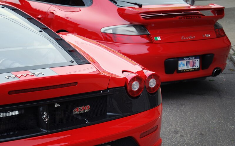 Red sports cars parked