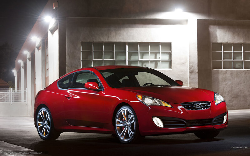 Red sports coupe at night