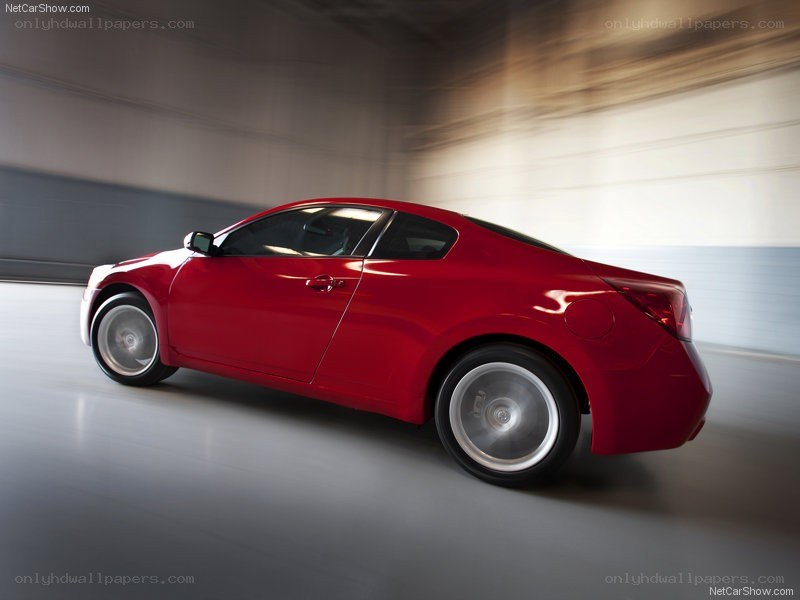 Red sports coupe in motion