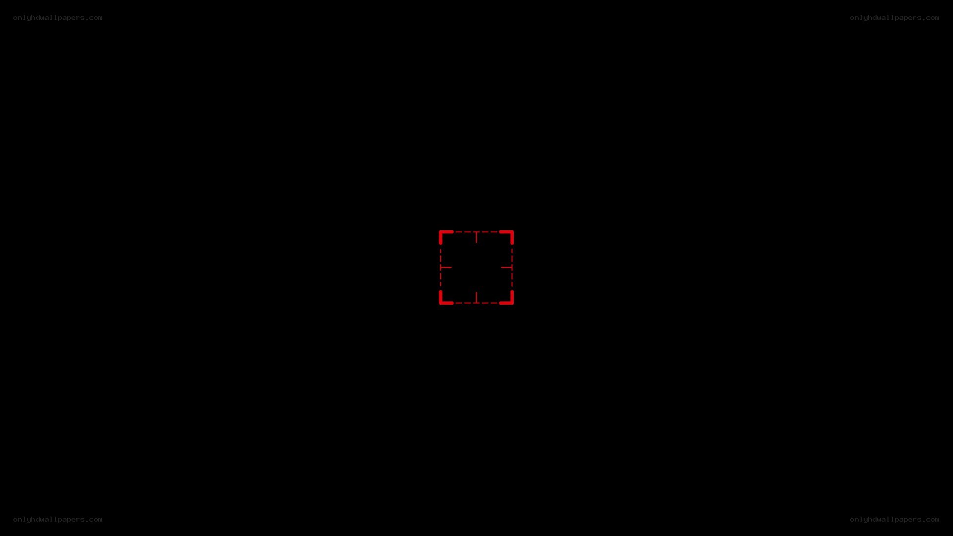 red square reticle on black
