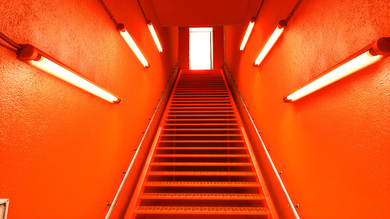 Red staircase with fluorescent lights