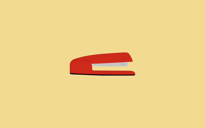 red stapler on yellow