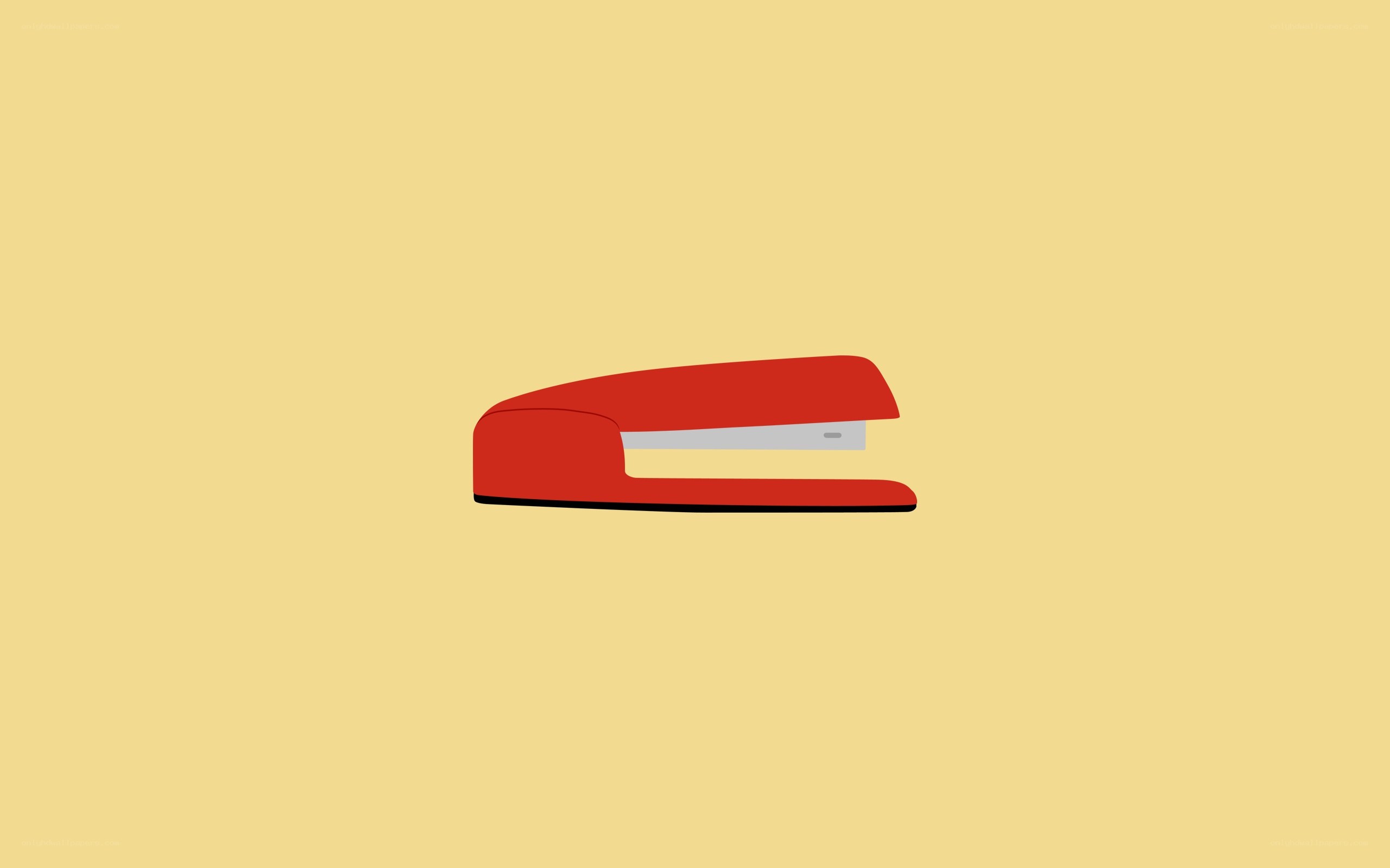 red stapler on yellow