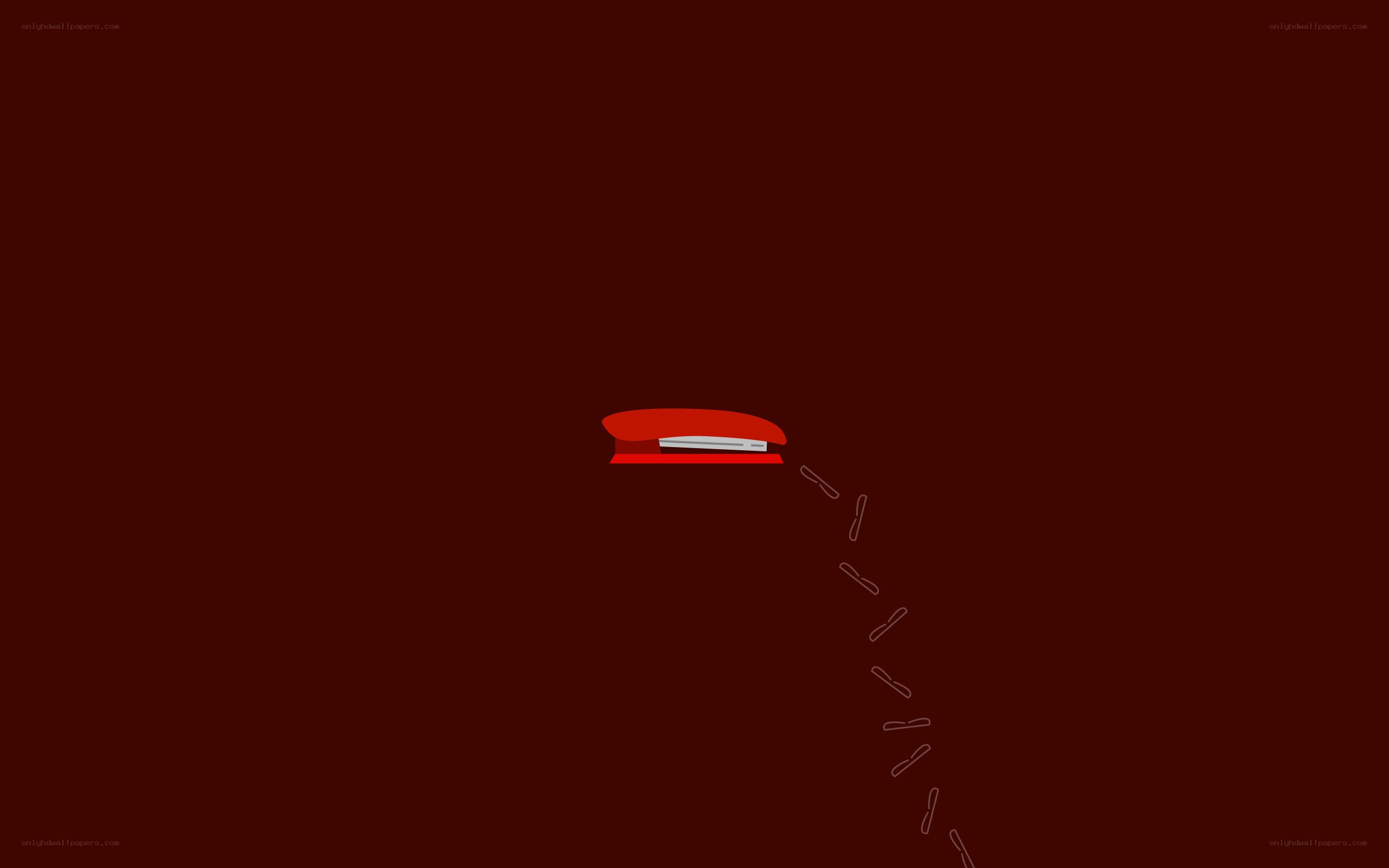 red stapler with paperclips
