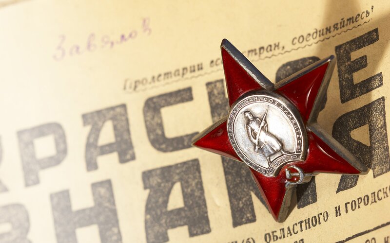 Red Star medal on Soviet poster
