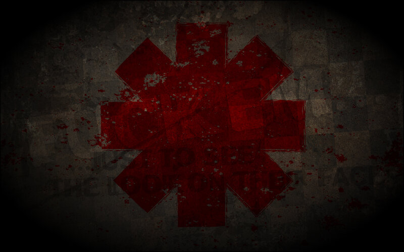 Red star symbol on dark background
