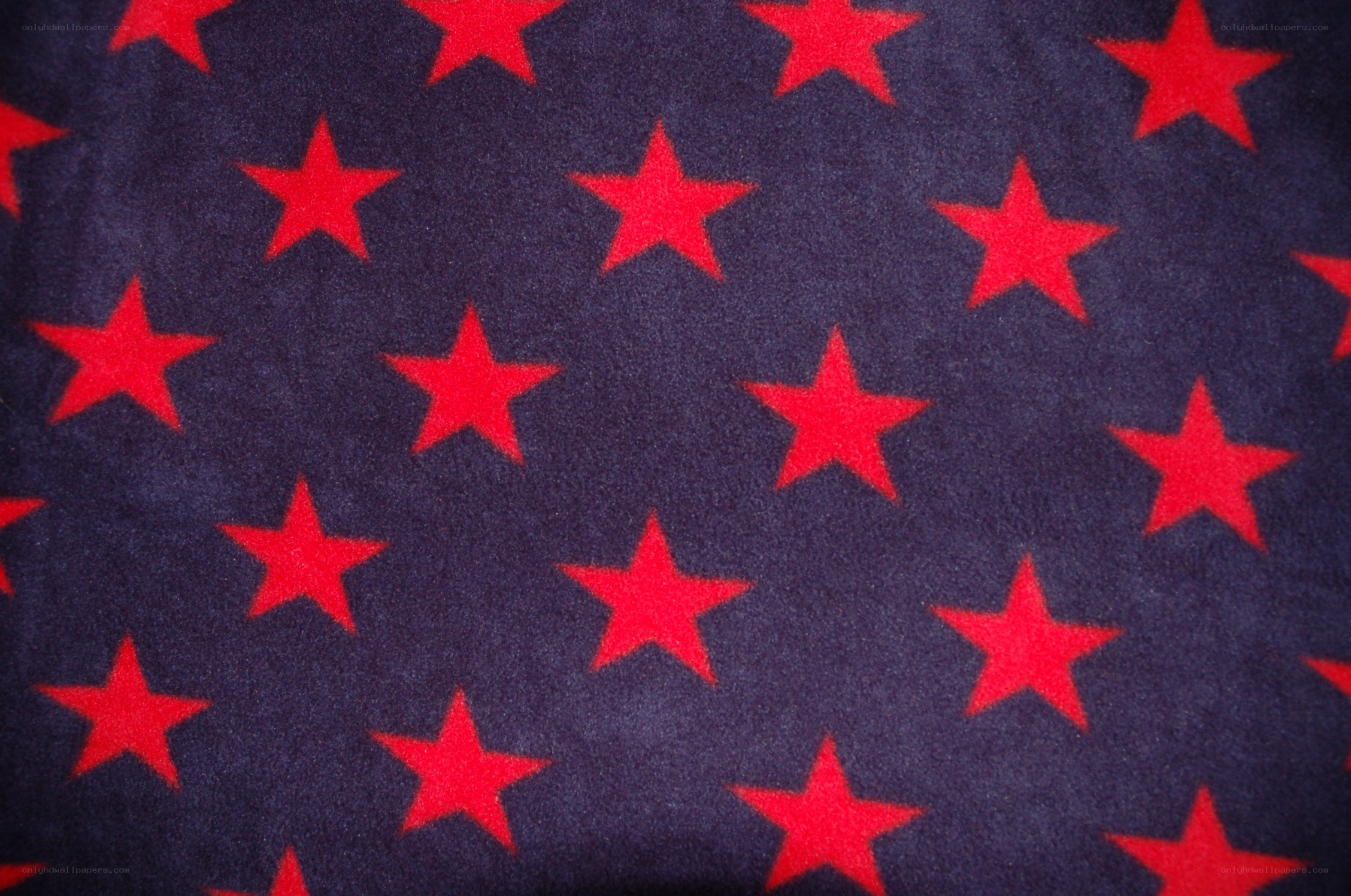 red stars on dark fabric
