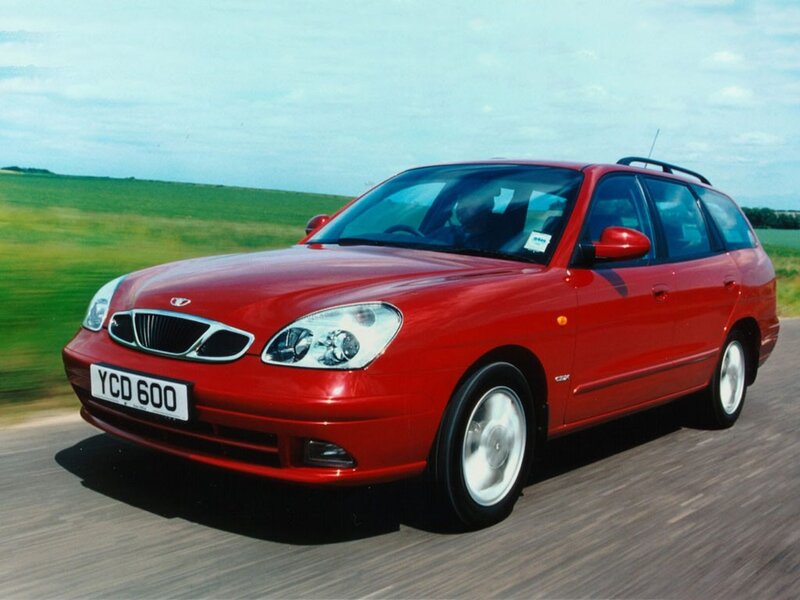 red station wagon driving on road
