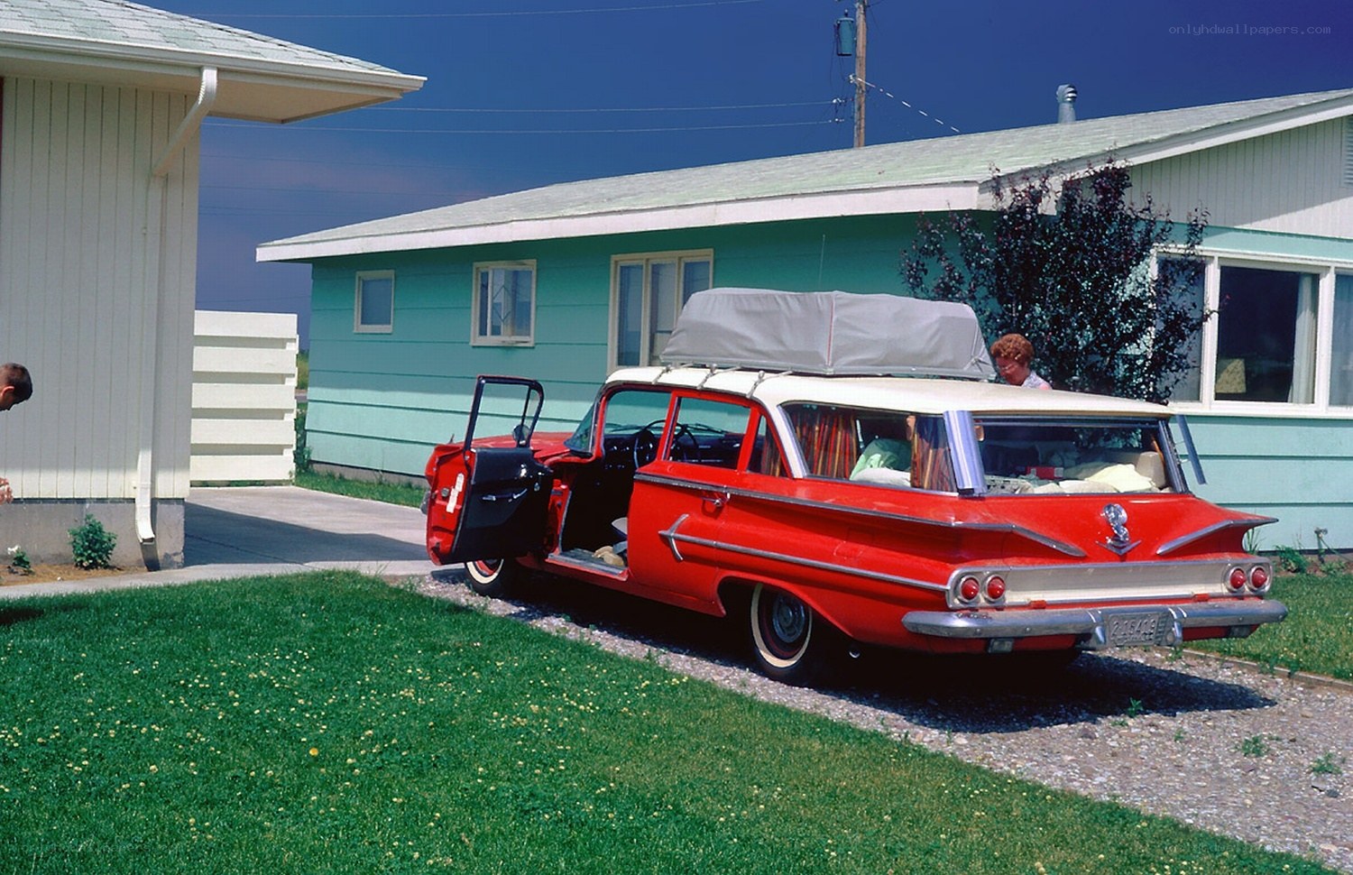 Red station wagon in driveway