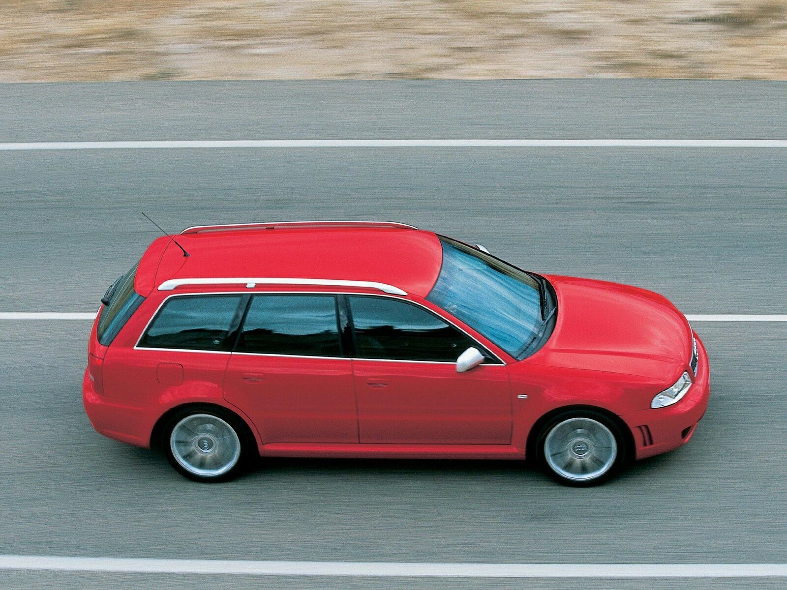 Red station wagon on road