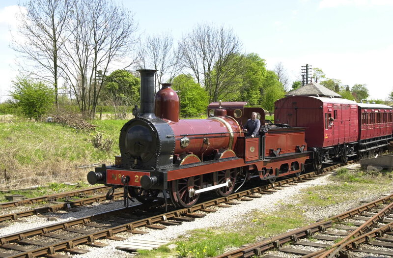 Red Steam Train on Tracks