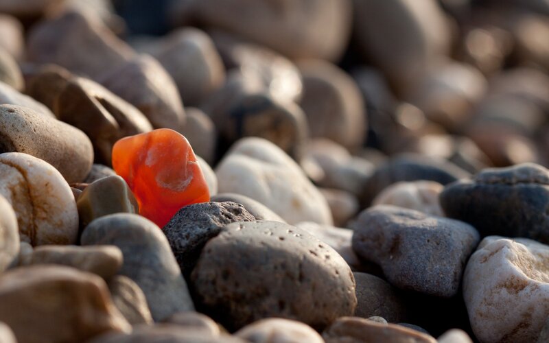 Red Stone Among Pebbles — Orange, Calm