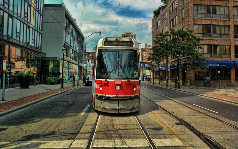 Red streetcar on city street