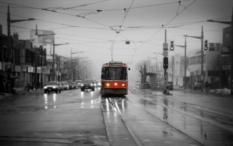 Red Streetcar on Wet Road