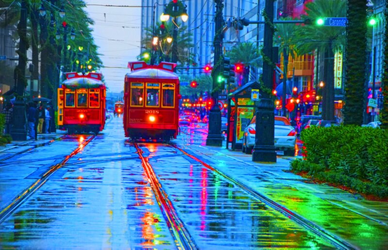 Red Streetcars on Wet Tracks