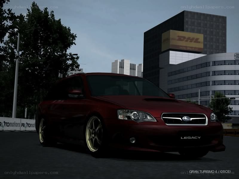 red subaru legacy in city