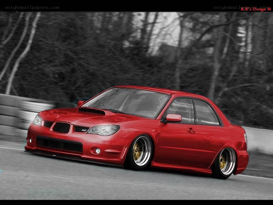 Red Subaru on a racetrack