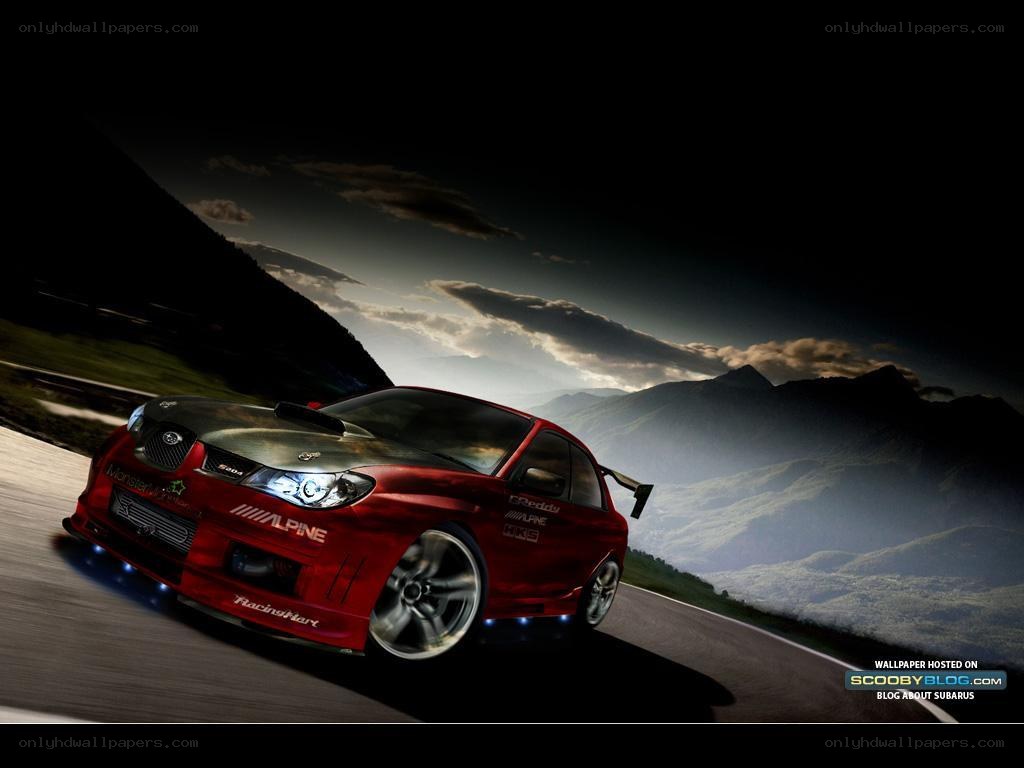 red subaru on mountain road