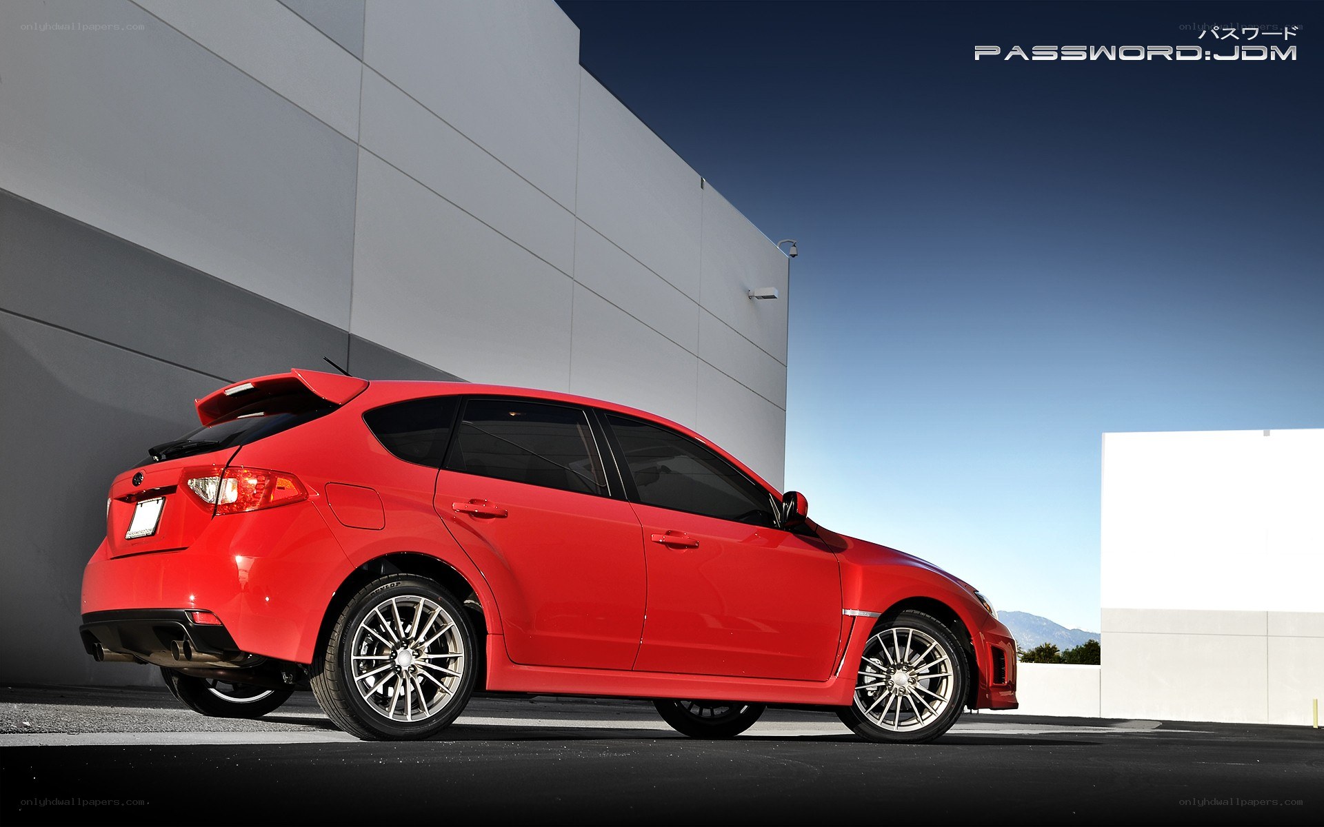 Red Subaru WRX parked outside