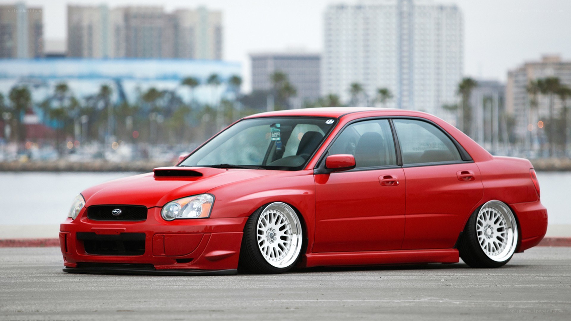 Red Subaru WRX sedan