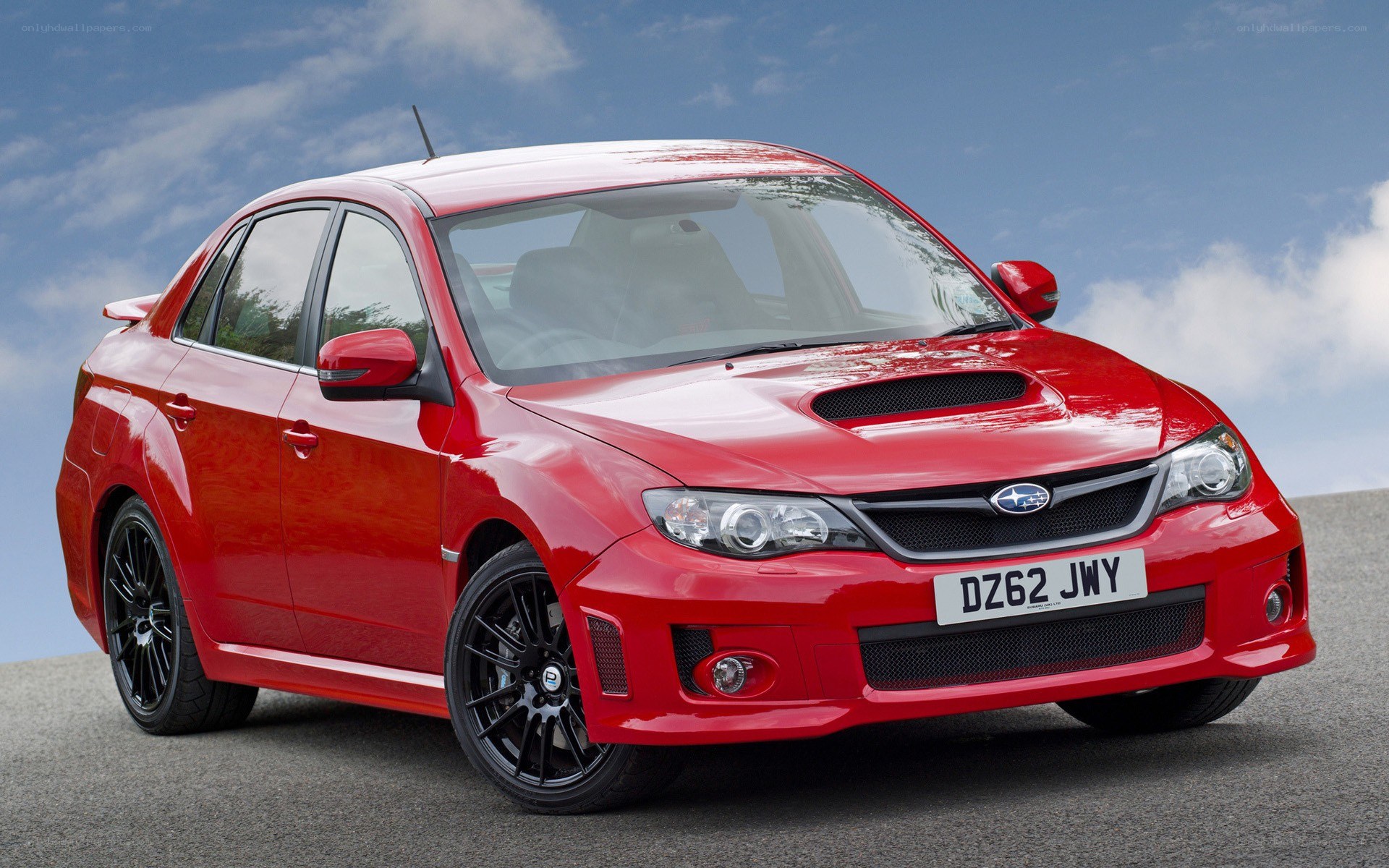 red subaru wrx sti sedan
