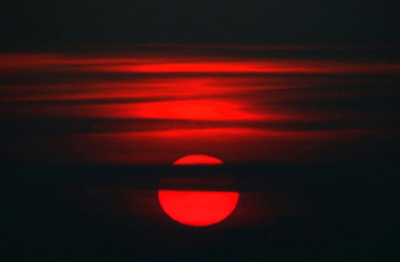 Red Sun at Sunset — Dramatic, Photograph