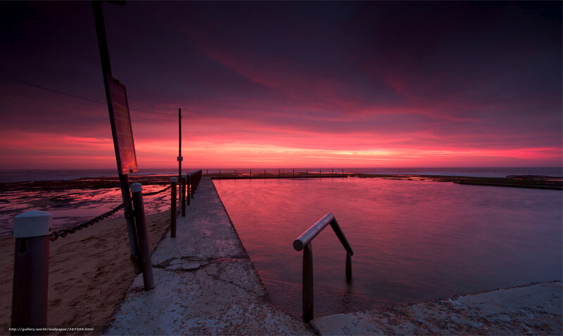 Red sunset at ocean pool