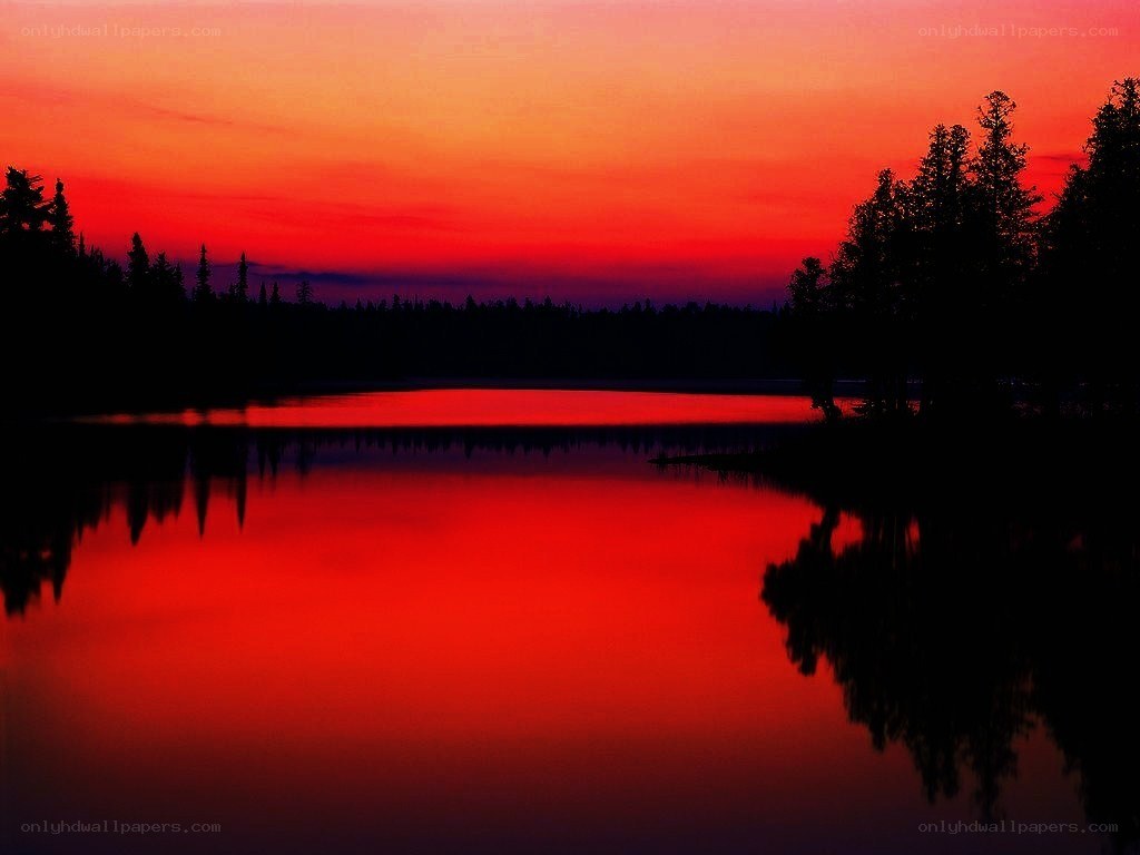 Red sunset over a calm lake