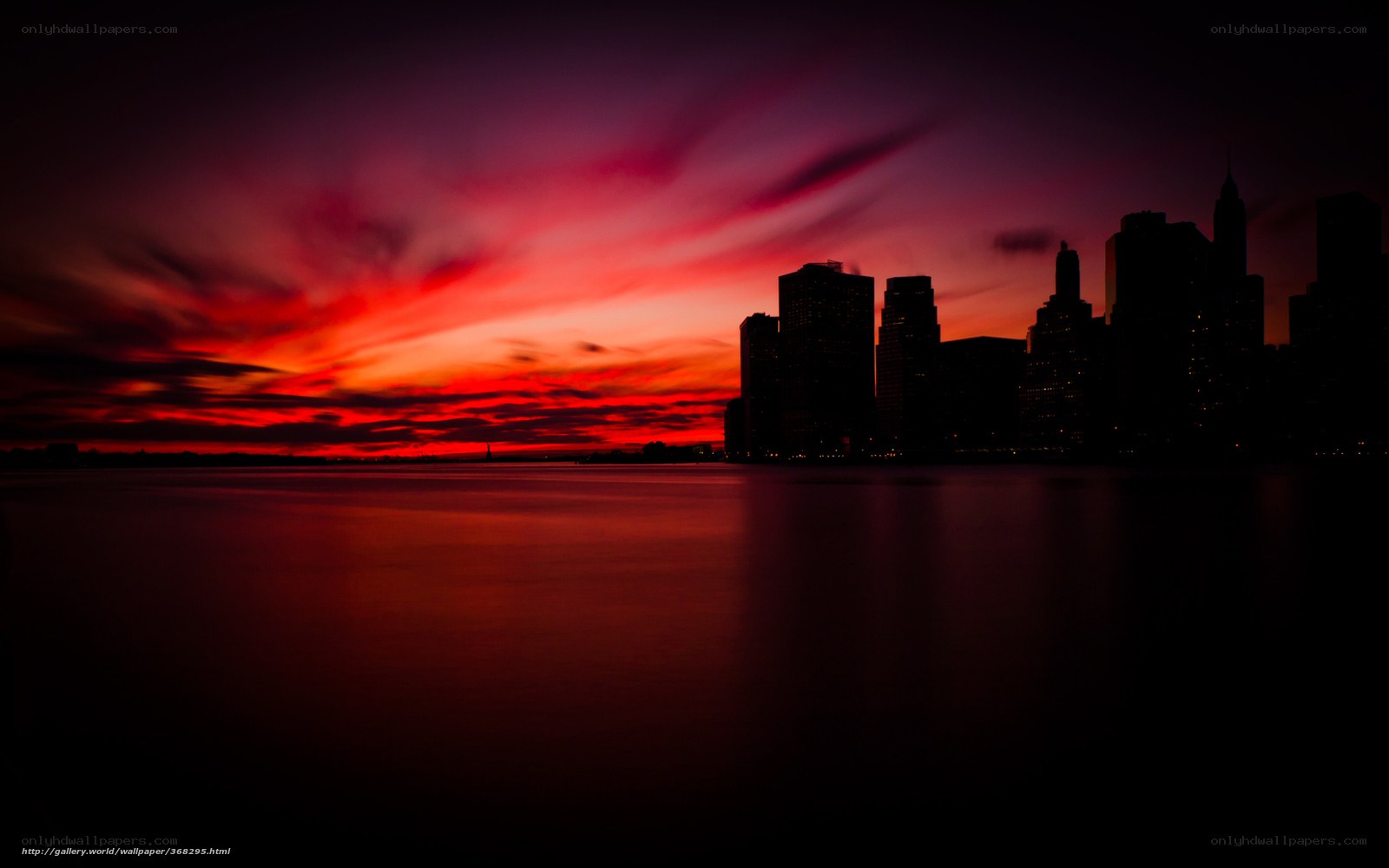 Red sunset over city skyline