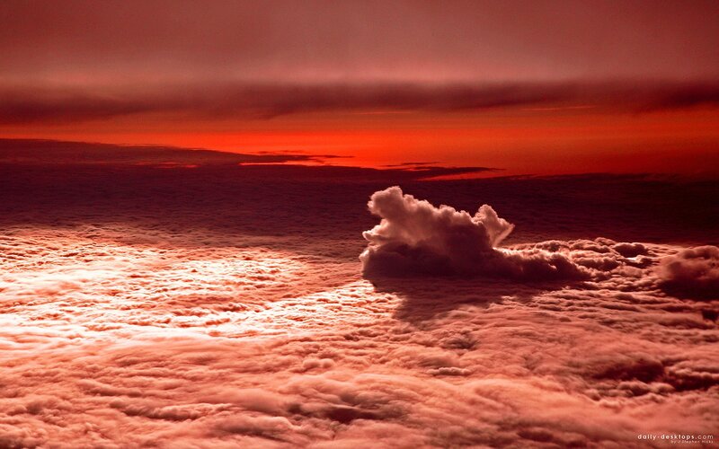 Red sunset over clouds