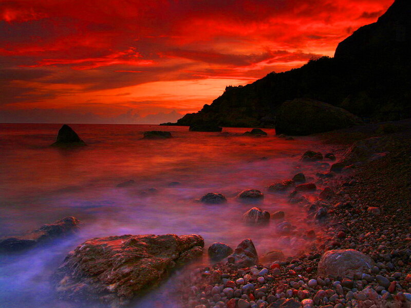 Red Sunset over Rocky Shore — Dramatic