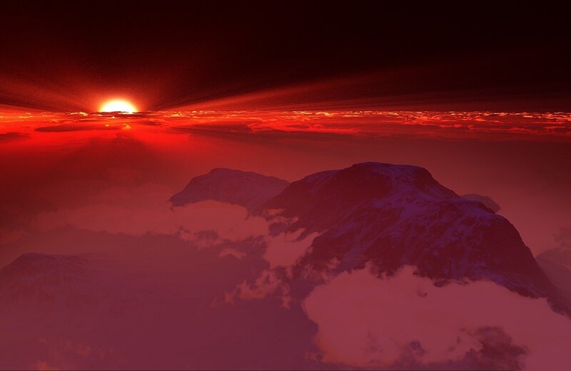 Red sunset over snow-capped mountains