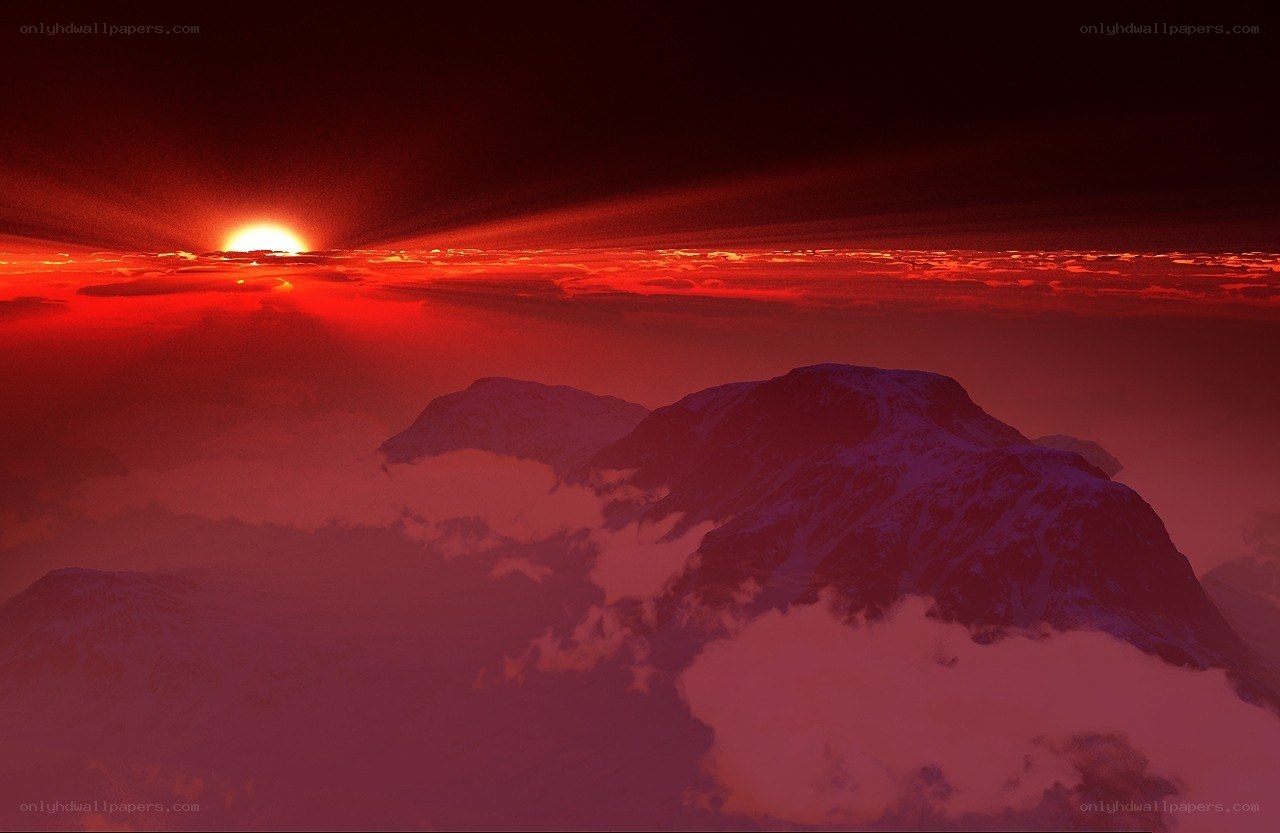 Red sunset over snow-capped mountains