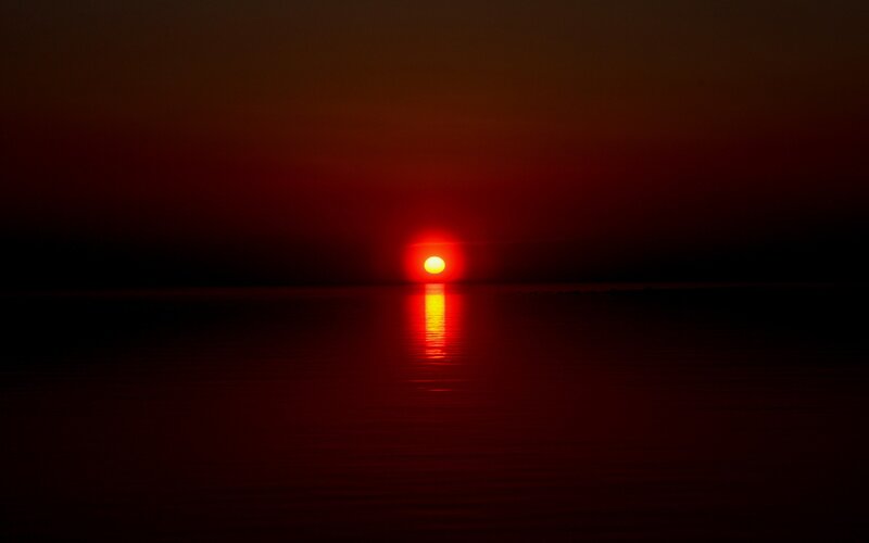 Red sunset over water