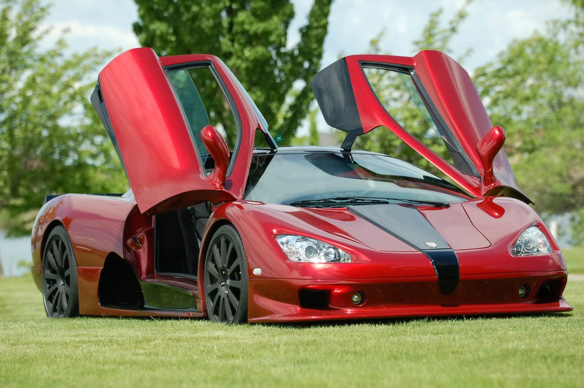 Red supercar with doors open